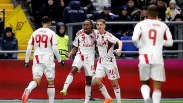 Soccer Football - UEFA Champions League - Kairat v Olympiacos - Astana Arena, Astana, Kazakhstan - December 9, 2025 Olympiacos' Gelson Martins celebrates scoring their first goal with Christos Mouzakitis and Mehdi Taremi REUTERS/Pavel Mikheyev