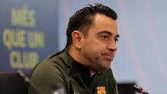 Barcelona's Spanish coach Xavi addresses a press conference at the Joan Gamper training ground in Sant Joan Despi, near Barcelona, on April 25, 2024. Xavi will remain as coach of Barcelona, the Spanish giants told AFP on April 24, despite having announced in January that he planned to quit at the end of the season due to the "cruel and unpleasant" nature of the job. (Photo by LLUIS GENE / AFP)