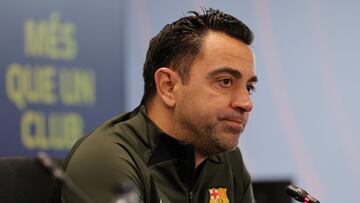 Barcelona's Spanish coach Xavi addresses a press conference at the Joan Gamper training ground in Sant Joan Despi, near Barcelona, on April 25, 2024. Xavi will remain as coach of Barcelona, the Spanish giants told AFP on April 24, despite having announced in January that he planned to quit at the end of the season due to the "cruel and unpleasant" nature of the job. (Photo by LLUIS GENE / AFP)