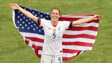 Soccer Football - Women's World Cup Final - United States v Netherlands - Groupama Stadium, Lyon, France - July 7, 2019  Kelley O'Hara of the U.S. celebrates winning the Women's World Cup with a flag  REUTERS/Lucy Nicholson
