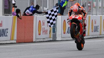 Repsol Honda Team Spanish rider Marc Marquez celebrates winning the Malaysia MotoGP at the Sepang International Circuit in Sepang on November 4, 2018. (Photo by Mohd RASFAN / AFP)