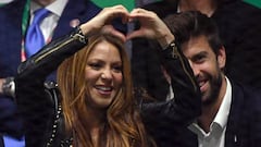 (FILES) In this file photo taken on November 24, 2019, Colombian singer Shakira signs a heart beside her husband Barcelona's Spanish defender and Kosmos president Gerard Pique as they watch Spain's Rafael Nadal playing Canada's Denis Shapovalov during the final singles tennis match between Canada and Spain at the Davis Cup Madrid Finals 2019 in Madrid. - Colombian singer Shakira set social media on fire on January 12, 2023, after releasing a song openly aimed at her ex-husband, Spanish former footballer Gerard Pique, which has been listened to 34 million times in 17 hours amid a cascade of reactions. (Photo by GABRIEL BOUYS / AFP)