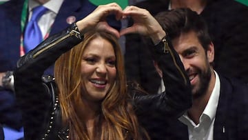 (FILES) In this file photo taken on November 24, 2019, Colombian singer Shakira signs a heart beside her husband Barcelona's Spanish defender and Kosmos president Gerard Pique as they watch Spain's Rafael Nadal playing Canada's Denis Shapovalov during the final singles tennis match between Canada and Spain at the Davis Cup Madrid Finals 2019 in Madrid. - Colombian singer Shakira set social media on fire on January 12, 2023, after releasing a song openly aimed at her ex-husband, Spanish former footballer Gerard Pique, which has been listened to 34 million times in 17 hours amid a cascade of reactions. (Photo by GABRIEL BOUYS / AFP)