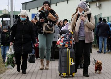 After a distressing, hours-long journey, Ukrainians cross the border with Poland into the city of Medyka.