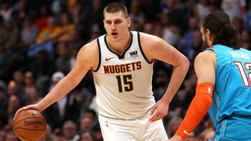 DENVER, COLORADO - FEBRUARY 26: Nikola Jokic #15 of the Denver Nuggets drives against Steven Adams #12 of the Oklahoma City Thunder in the fourth quarter at the Pepsi Center on February 26, 2019 in Denver, Colorado. NOTE TO USER: User expressly acknowledges and agrees that, by downloading and or using this photograph, User is consenting to the terms and conditions of the Getty Images License Agreement.   Matthew Stockman/Getty Images/AFP
 == FOR NEWSPAPERS, INTERNET, TELCOS &amp; TELEVISION USE ONLY ==
