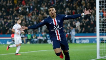 Paris Saint-Germain&#039;s French forward Kylian Mbappe celebrates after scoring a goal during the French L1 football match between Paris Saint-Germain (PSG) and Lyon (OL) at the Parc des Princes stadium in Paris, on February 9, 2020. (Photo by GEOFFROY V