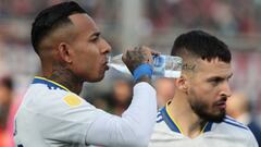 Boca Juniors' Colombian forward Sebastian Villa (L) drinks water next to his teammate forward Dario Benedetto before their Argentine Professional Football League Tournament 2022 match against San Lorenzo at Nuevo Gasometro stadium in Buenos Aires, on July 9, 2022. (Photo by ALEJANDRO PAGNI / AFP) (Photo by ALEJANDRO PAGNI/AFP via Getty Images)