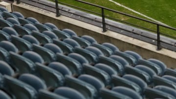 MELBOURNE, AUSTRALIA - MAY 28: Ed Langdon of the Demons warms up as empty seats are seen as patrons are banned from attending due to the latest Covid-19 outbreak in Melbourne before the 2021 AFL Round 11 match between the Western Bulldogs and the Melbourn