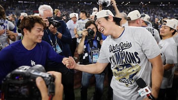 TORONTO, ONTARIO - NOVEMBER 02: (L-R) Yoshinobu Yamamoto #18 and Shohei Ohtani #17 of the Los Angeles Dodgers celebrate after defeating the Toronto Blue Jays 5-4 in game seven to win the 2025 World Series at Rogers Center on November 02, 2025 in Toronto, Ontario. Emilee Chinn/Getty Images/AFP (Photo by Emilee Chinn / GETTY IMAGES NORTH AMERICA / Getty Images via AFP)