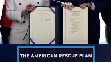 FILE PHOTO: House Speaker Nancy Pelosi (D-CA) and Senate Majority Leader Chuck Schumer display the &quot;American Rescue Plan&quot; during the enrolment ceremony following passage of U.S. President Joe Biden&#039;s $1.9 trillion coronavirus disease (COVID