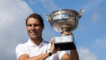 Rafael Nadal of Spain poses with his trophy on the Alexandre III bridge in front of the Eiffel Tower a day after winning his 14th the French Open tennis title tournament, Roland Garros. (Photo by Ibrahim Ezzat/NurPhoto via Getty Images)