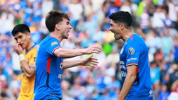 Soccer Football - Liga MX - Cruz Azul v Tigres UANL - Estadio Cuauhtemoc, Puebla, Mexico - February 15, 2026 Cruz Azul's Agustin Palavecino and Nicolas Ibanez celebrate after Tigres UANL's Joaquim scores Cruz Azul's first with an own goal REUTERS/Eloisa Sanchez