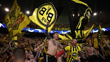 Dortmund fans celebrate their victory at the end of their UEFA Champions League semi-final second leg football match against Paris Saint-Germain (PSG) at the Parc des Princes stadium in Paris on May 7, 2024. (Photo by Anne-Christine POUJOULAT / AFP)