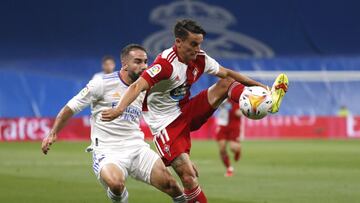 Soccer Football - LaLiga - Real Madrid v Celta Vigo - Santiago Bernabeu, Madrid, Spain - September 12, 2021 Celta Vigo's Franco Cervi in action with Real Madrid's Dani Carvajal REUTERS/Susana Vera