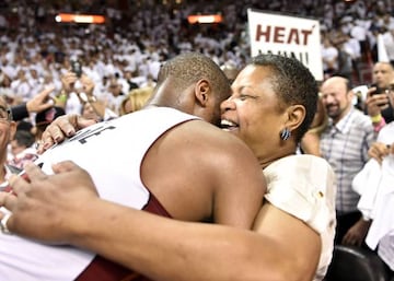 Wade hugs his mother Jolinda after pulling level with the Raptors