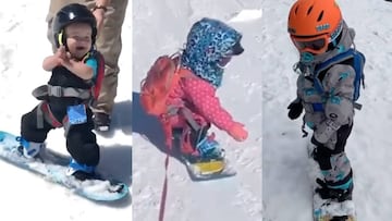 Ni&ntilde;os peque&ntilde;os practicando snowboard.