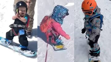 Niños pequeños practicando snowboard.