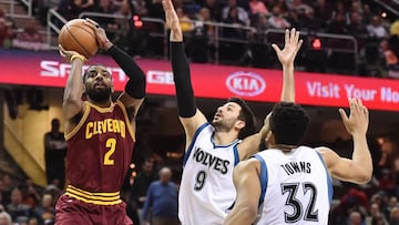 Feb 1, 2017; Cleveland, OH, USA; Cleveland Cavaliers guard Kyrie Irving (2) shoots over the defense of Minnesota Timberwolves guard Ricky Rubio (9) during the second half at Quicken Loans Arena. The Cavs won 125-97. Mandatory Credit: Ken Blaze-USA TODAY Sports