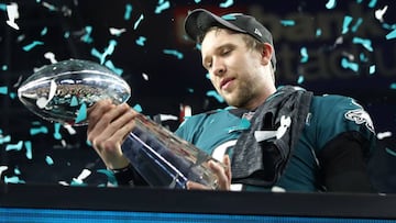 MINNEAPOLIS, MN - FEBRUARY 04: Nick Foles #9 of the Philadelphia Eagles celebrates with the Vince Lombardi Trophy after defeating the New England Patriots 41-33 in Super Bowl LII at U.S. Bank Stadium on February 4, 2018 in Minneapolis, Minnesota. Elsa/G