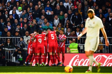 Girona's players celebrate after scoring a penalty 