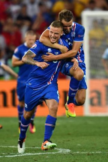 Iceland's defender Ragnar Sigurdsson couldn't have imagined scoring against England to help his team reach the Euro quarter finals. Here he is being jumped on by Kari Arnason.