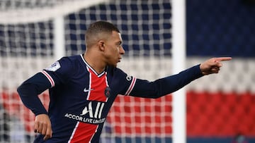 Paris Saint-Germain's French forward Kylian Mbappe celebrates after scoring a goal during the French L1 football match between Paris-Saint Germain (PSG) and Montpellier at The Parc des Princes Stadium in Paris on January 22, 2021. (Photo by Franck FI