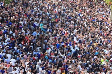 Soccer Football - World Cup - France Victory Parade on the Champs Elysees - Paris, France - July 16, 2018   France fans gather as they await the arrival of the team   REUTERS/Gonzalo Fuentes