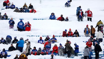 ORCHARD PARK, NEW YORK - JANUARY 15: Fans take their seats in the snow before the game between the Buffalo Bills and the Pittsburgh Steelers at Highmark Stadium on January 15, 2024 in Orchard Park, New York.