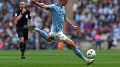 Referee Stuart Attwell (L) blows his whistle to stop the play for an incident, just before Manchester City's Norwegian striker Erling Haaland strikes the ball to score, during the English FA Cup semi-final football match between Manchester City and Sheffield United at Wembley Stadium in north west London on April 22, 2023. (Photo by Adrian DENNIS / AFP) / NOT FOR MARKETING OR ADVERTISING USE / RESTRICTED TO EDITORIAL USE