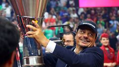 Panathinaikos BC coach Ergin Ataman celebrates with the trophy after winning the EuroLeague.
