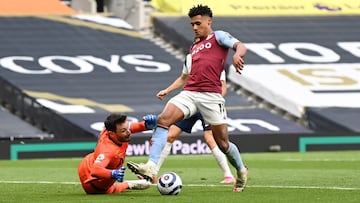 LONDON, ENGLAND - MAY 19: Ollie Watkins of Aston Villa is challenged by Hugo Lloris of Tottenham Hotspur during the Premier League match between Tottenham Hotspur and Aston Villa at Tottenham Hotspur Stadium on May 19, 2021 in London, England. A limited n