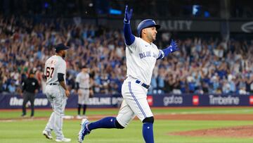 TORONTO, ON - APRIL 12: George Springer #4 of the Toronto Blue Jays celebrates a walk-off single in the tenth inning of their MLB game against the Detroit Tigers at Rogers Centre on April 12, 2023 in Toronto, Canada.   Cole Burston/Getty Images/AFP (Photo by Cole Burston / GETTY IMAGES NORTH AMERICA / Getty Images via AFP)