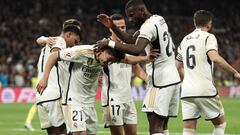 Real Madrid's Spanish forward #21 Brahim Diaz is congratulated by teammates for scoring his team's third goal during the Spanish league football match between Real Madrid CF and Villarreal CF at the Santiago Bernabeu stadium in Madrid on December 17, 2023. (Photo by Thomas COEX / AFP)