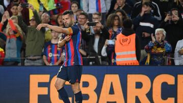 Barcelona's Spanish defender Jordi Alba fits the captain's armband after scoring a goal during the Spanish league football match between FC Barcelona and CA Osasuna at the Camp Nou stadium in Barcelona on May 2, 2023. (Photo by LLUIS GENE / AFP)