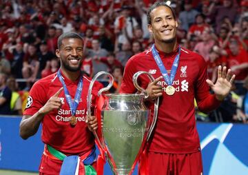 Double Dutch: Georgino Wijnaldum and Virgil van Dijk with the Champions League trophy