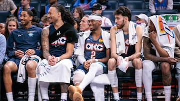 Shai Gilgeous-Alexander #2 of the Oklahoma City Thunder on the bench with Jaylin Williams #6 of the Oklahoma City Thunder and Chet Holmgren #7 of the Oklahoma City Thunder during the second half against the Dallas Mavericks at Paycom Center on December 5, 2025 in Oklahoma City, Oklahoma.