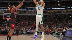 Apr 6, 2022; Chicago, Illinois, USA;Boston Celtics forward Jayson Tatum (0) shoots over Chicago Bulls guard Ayo Dosunmu (12)  during the first quarter at the United Center. Mandatory Credit: Dennis Wierzbicki-USA TODAY Sports