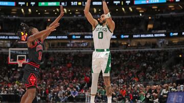 Apr 6, 2022; Chicago, Illinois, USA;Boston Celtics forward Jayson Tatum (0) shoots over Chicago Bulls guard Ayo Dosunmu (12) during the first quarter at the United Center. Mandatory Credit: Dennis Wierzbicki-USA TODAY Sports