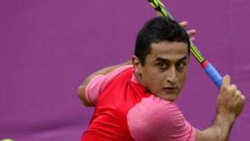 Spain&#039;s Nicolas Almagro returns to Viktor Troicki of Serbia during their Men&#039;s singles tennis match at the 2012 London Olympic Games in the All England Tennis Club in Wimbledon, southwest London, on July 28, 2012. AFP PHOTO/ Martin Bernetti