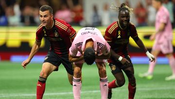ATLANTA, GEORGIA - SEPTEMBER 16: Brooks Lennon #11 and Tristan Muyumba #8 of Atlanta United celebrate after a goal as Sergio Busquets #5 of Inter Miami CF reacts during the first half at Mercedes-Benz Stadium on September 16, 2023 in Atlanta, Georgia.   Kevin C. Cox/Getty Images/AFP (Photo by Kevin C. Cox / GETTY IMAGES NORTH AMERICA / Getty Images via AFP)