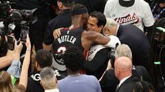 Jimmy Butler #22 of the Miami Heat hugs head coach Erik Spoelstra