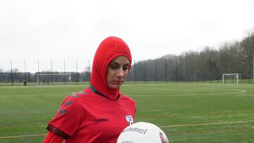 Afghani national soccer team player Shabnam Mabarz, wearing the new head-to-toe outfit with an integrated hijab, juggles with the ball in Copenhagen on Tuesday, March 8, 2016.