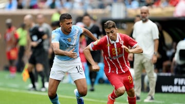 PHILADELPHIA, PENNSYLVANIA - JUNE 18: Oussama Zemraoui #23 of Wydad AC is challenged by Rodri #16 of Manchester City during the FIFA Club World Cup 2025 group G match between Manchester City FC and Wydad AC at Lincoln Financial Field on June 18, 2025 in Philadelphia, Pennsylvania. David Ramos/Getty Images/AFP (Photo by David Ramos / GETTY IMAGES NORTH AMERICA / Getty Images via AFP)