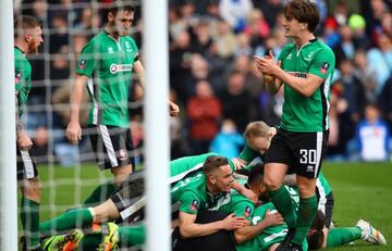 Sean Raggett of Lincoln City (obscure) celebrates scoring his sides first goal with his Lincoln City team mates during The Emirates FA Cup Fifth Round match between Burnley and Lincoln City at Turf Moor on February 18, 2017 in Burnley, England.