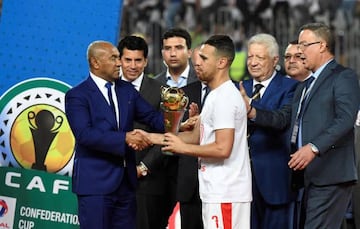 May 26, 2019 Egypt's Zamalek player Hazem Emam (C) receives the trophy from the president of the African Football Federation Ahmed Ahmed (L) after they won the CAF Confederation Cup final football match between Egypt's Zamalek and Morocco's RSB Berkane