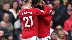 Manchester United's Brazilian midfielder Casemiro (R) is consoled by Manchester United's Brazilian midfielder Antony (L) after being shown a red card by English referee Anthony Taylor during the English Premier League football match between Manchester United and Southampton at Old Trafford in Manchester, north-west England, on March 12, 2023. (Photo by Darren Staples / AFP) / RESTRICTED TO EDITORIAL USE. No use with unauthorized audio, video, data, fixture lists, club/league logos or 'live' services. Online in-match use limited to 120 images. An additional 40 images may be used in extra time. No video emulation. Social media in-match use limited to 120 images. An additional 40 images may be used in extra time. No use in betting publications, games or single club/league/player publications. / 