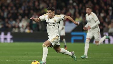(FILES) Real Madrid's Spanish forward #21 Brahim Diaz runs with the ball during the Spanish league football match between Real Madrid CF and Villarreal CF at the Santiago Bernabeu stadium in Madrid on December 17, 2023. Real Madrid midfielder Brahim Diaz, who has dual Spanish and Moroccan nationality, has chosen to play for Morocco, the Spanish press said, AFP reports on March 12, 2024. (Photo by Thomas COEX / AFP)