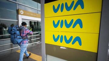 A man passes by an advertising board of Viva Air outside the El Dorado international airport in Bogota on February 28, 2023. - The Colombian low-cost airline Viva Air suspended its operations last Monday due to financial problems, according to a company statement. (Photo by Juan Barreto / AFP) (Photo by JUAN BARRETO/AFP via Getty Images)