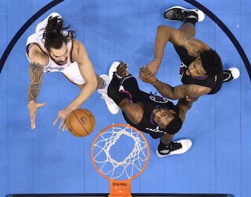 Clippers Jeff Green, DeAndre Jordan fight with Steven Adams for the ball as the Thunder take on the Clippers in Chesapeake Energy Arena.