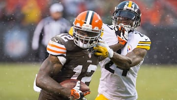 CLEVELAND, OH - NOVEMBER 24: Wide receiver Josh Gordon #12 of the Cleveland Browns completes a pass for a first down while under pressure from cornerback Ike Taylor #24 of the Pittsburgh Steelers during the second half at FirstEnergy Stadium on November 24, 2013 in Cleveland, Ohio. The Steelers defeated the Browns 27-11.   Jason Miller/Getty Images/AFP
 == FOR NEWSPAPERS, INTERNET, TELCOS &amp; TELEVISION USE ONLY ==